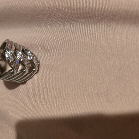 Twist Engagement Ring Featuring Round Brilliant Diamond Silver and White Twisting Diamond Ring